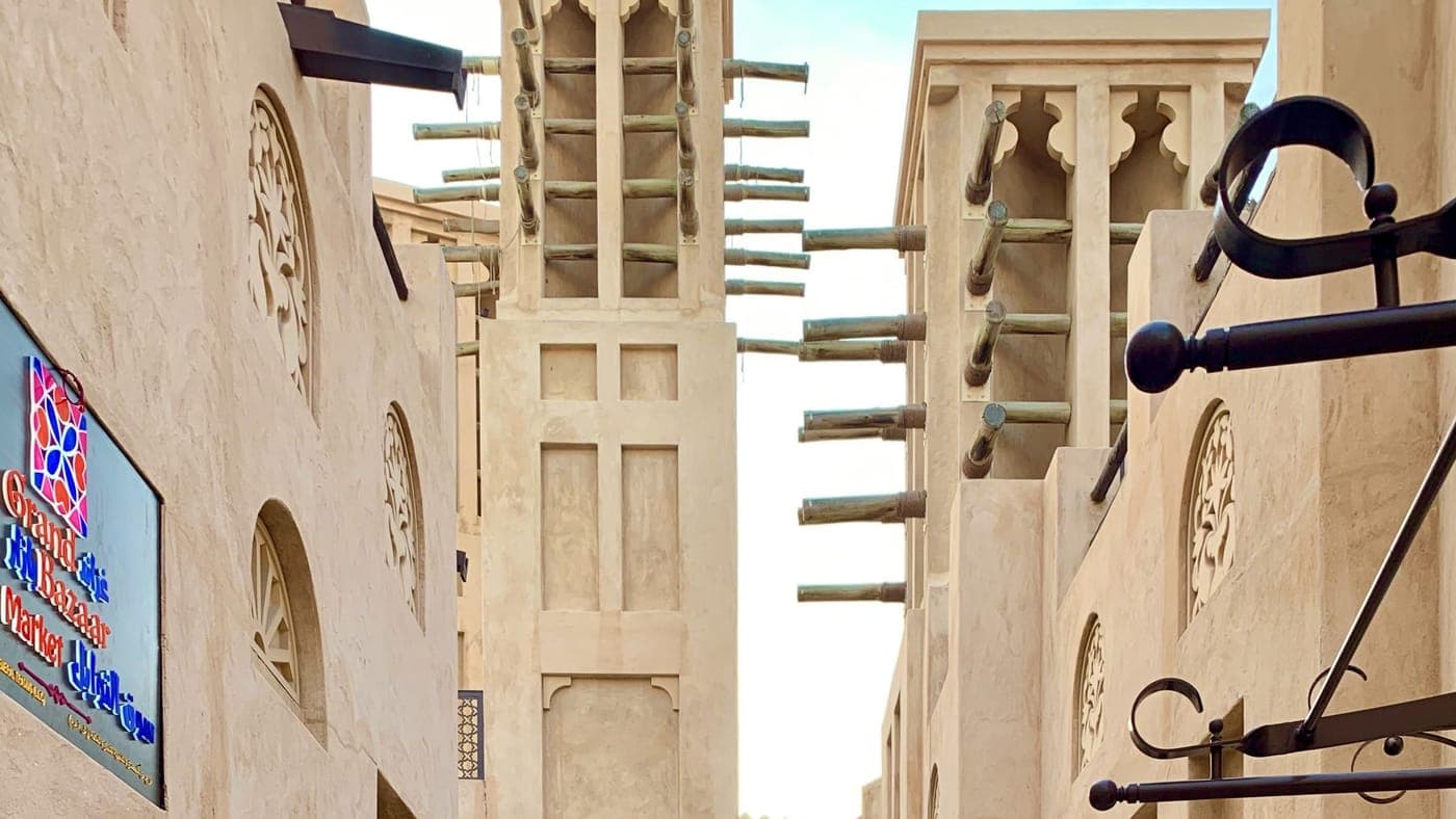 Wind towers above a souk alley in Umm Suqeim