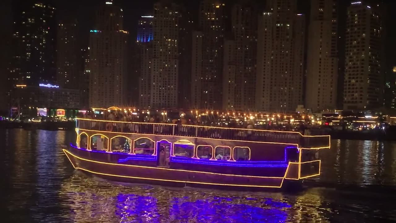 A dhow on Dubai Creek at night