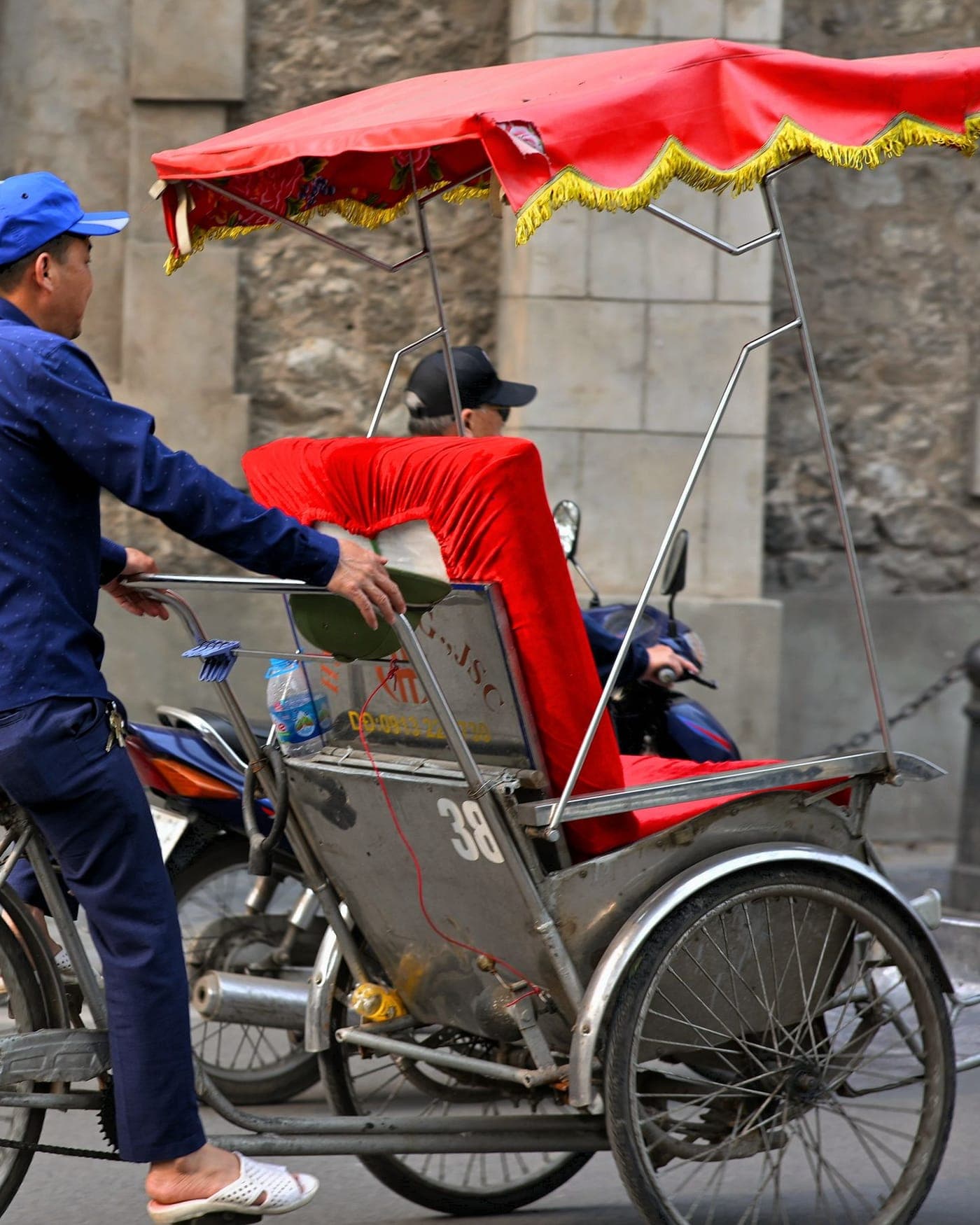 A cyclo on a street in Hanoi