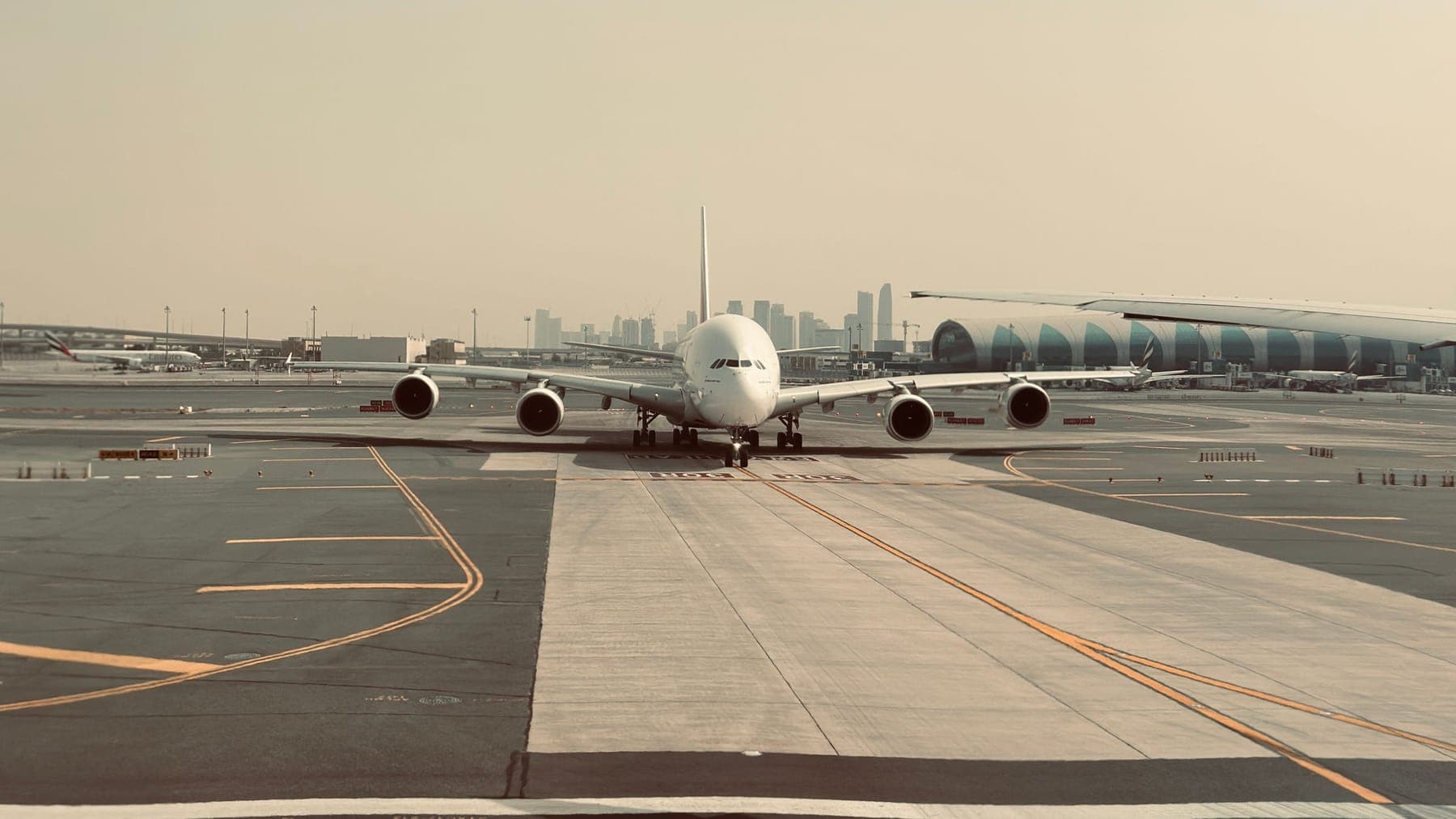 An aircraft on the tarmac at Dubai International Airport